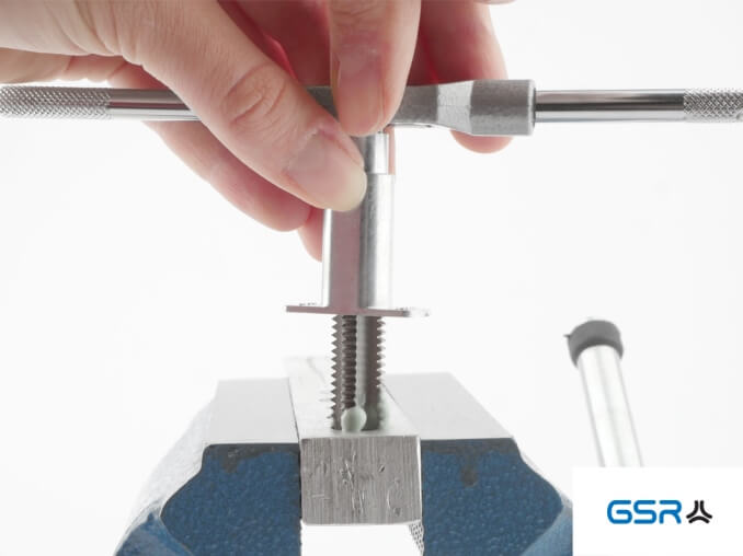 Alignment of the GSR Hand Tap Guides with clamped tap and adjustable tap wrench on the workpiece