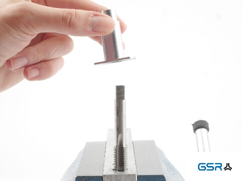 Application of the GSR Hand Tap Guides with clamped tap and adjustable tap wrench on the workpiece